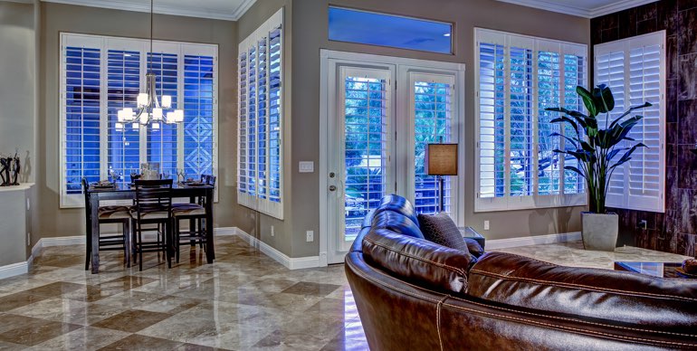Raleigh great room with classic shutters and modern lighting.